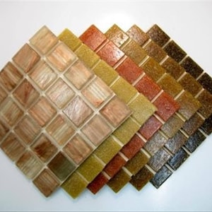 May include: A set of six mosaic tiles in various shades of brown, yellow, and red. The tiles are arranged in a graduated pattern, with the lightest shade at the top and the darkest shade at the bottom.