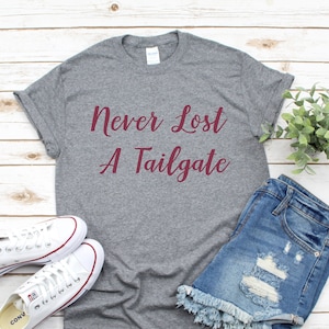 Tailgate Shirt l Never Lost A Tailgate Tee l College Football Shirt l Printed Cotton Tee l Classic Crew Neck Tee l Women's T-Shirt