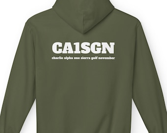 May include: An olive green hooded sweatshirt featuring the white text CA1SGN printed in a bold font, with the words charlie alpha one sierra golf november printed in a smaller white font directly underneath the main text on the back.