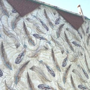 Back of quilt showing the Prairie Point Hanging Method.