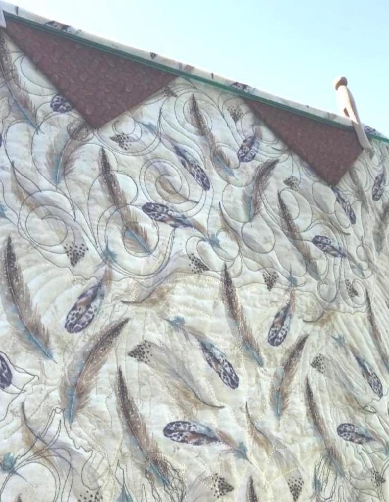 Back of quilt showing the Prairie Point Hanging Method.