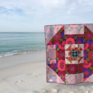 Dash About displayed at the beach with surf in the background.