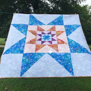 Image of VariLovable Star Quilt made with both beautiful sides of Hoffman fabric.