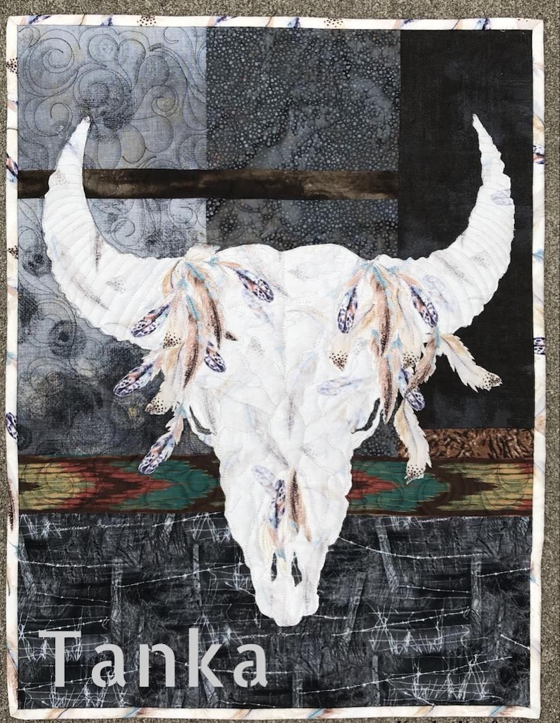 Bison skull applique and broderie perse quilt with title of pattnern.