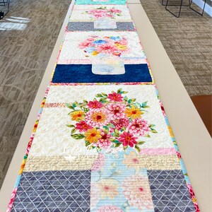 Line up of class quilts.