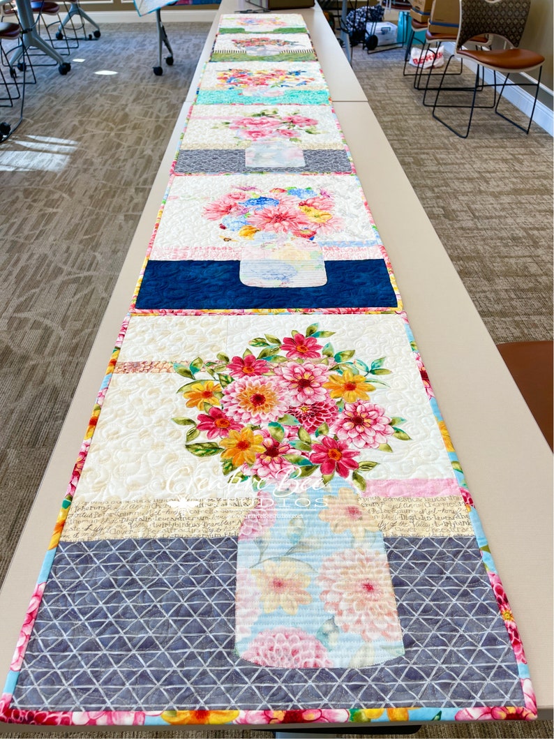 Line up of class quilts.