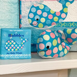 Bubbles Mini Quilt Pattern, Bubbles Cuddle, and The Adventure of Bubbles the Baby Whale soft book.