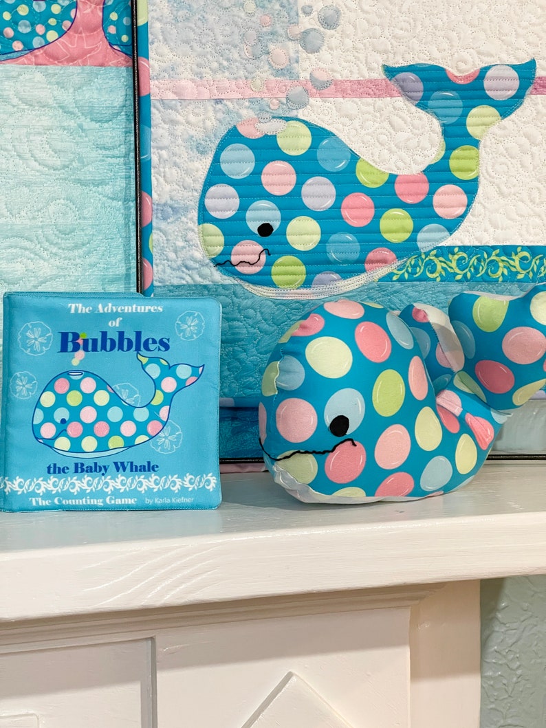 Bubbles Mini Quilt Pattern, Bubbles Cuddle, and The Adventure of Bubbles the Baby Whale soft book.