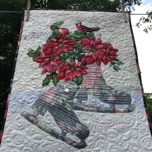 Noelle quilt hanging from clothesline.