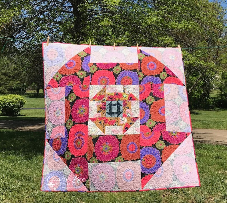 Churn dash quilt made with both sides of three fabrics.