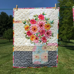 Outdoor shot of Grace quilt made with another focus fabric.