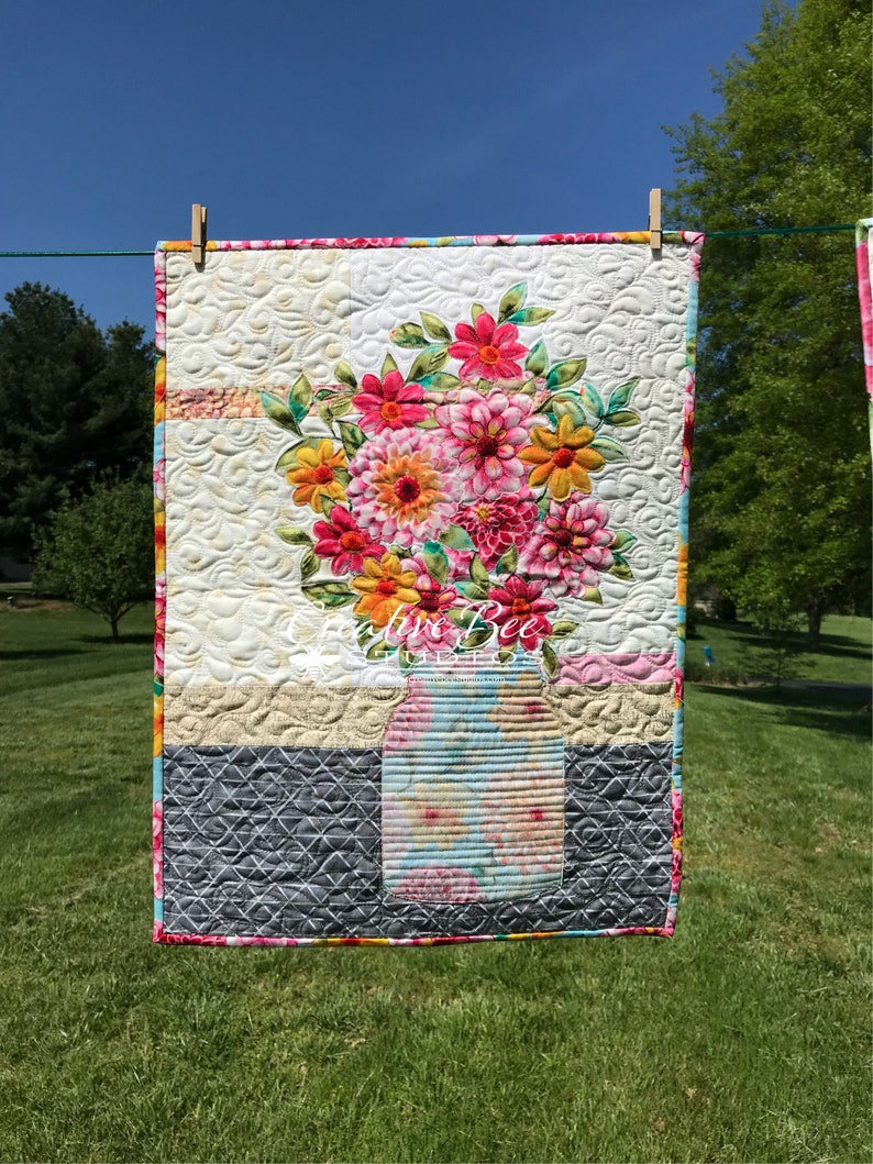 Outdoor shot of Grace quilt made with another focus fabric.