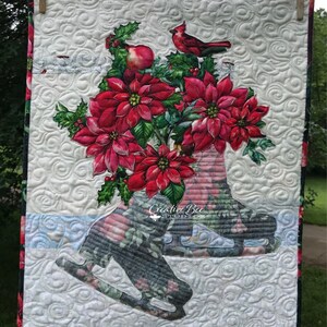 Christmas bouquet quilt hanging from clothesline.