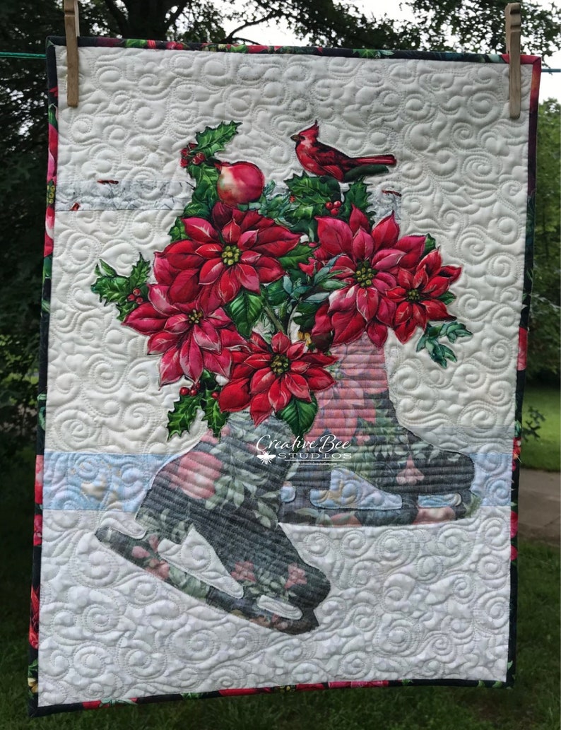 Christmas bouquet quilt hanging from clothesline.