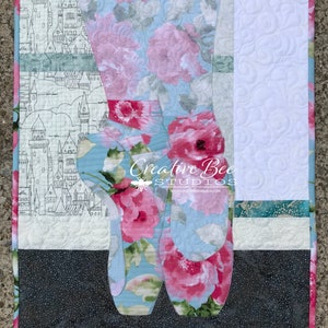 Full view of Angelina (ballerina) quilt made with both sides of one focus fabric.