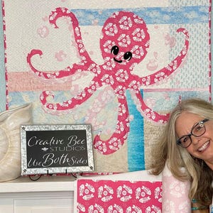 Octopus quilt pattern shown made with both sides of Fishbone Dance pink fabric designed by Karla Kiefner.