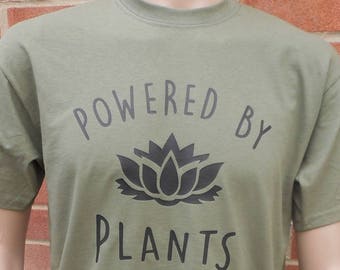 New POWERED by PLANTS novelty funny vegetarian or vegan Printed High Quality Cotton T-Shirt. Various Tee Sizes and Colours. Unisex Loose Fit