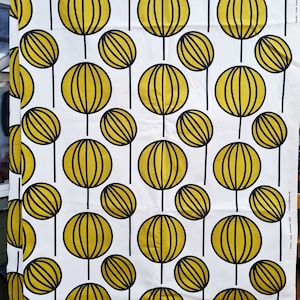 May include: White fabric with a repeating pattern of yellow circles with black outlines. The circles have a striped design inside.