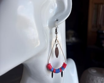 Fashionable dangle earrings in silver, red, and blue
