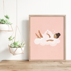 May include: A pink and white illustration of a person relaxing in a bubble bath with a glass of wine. The person is wearing cucumber eye patches and has brown skin and hair.