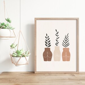 May include: A framed print with a minimalist design featuring three stylized vases with plants. The vases are different shades of brown and the plants are black.