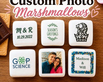 May include: An assortment of custom photo marshmallows with various designs. Some marshmallows feature text like "M&R 10.29.2022", "Season's Greetings", "G&P Science", and "Madison & Will". One marshmallow has a photo of a couple.
