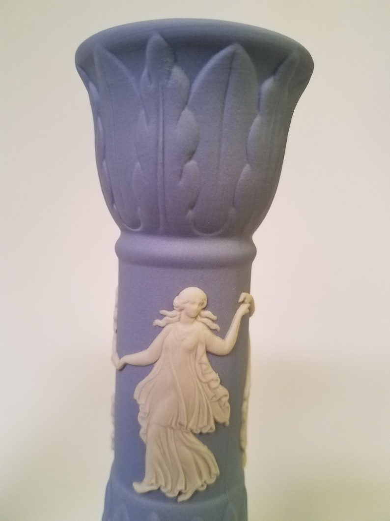 vintage Wedgwood pair of blue Jasperware candlesticks featuring the Dancing Hours