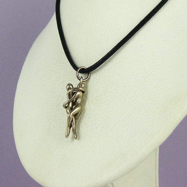 Man/Man Embrace Puzzle Pendant-Bronze