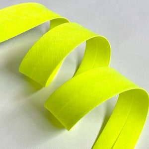 Plain fluorescent yellow bias binding folded 2 folds 2cm wide sold by the meter