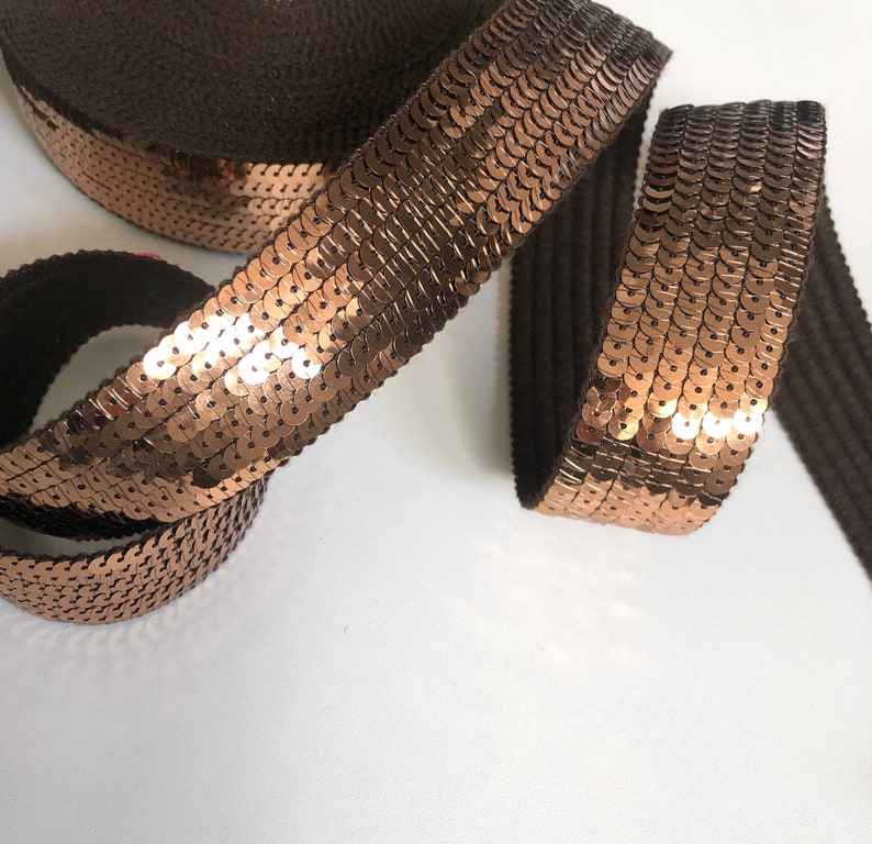 sold to the cut in multiples of 20cm BRONZE SEquins 6 rows of round sequins in 3cm wide