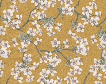 Japanese-print cotton oilcloth with ochre yellow apple blossom design, coated with a satin finish, sold by the cut in 10cm increments