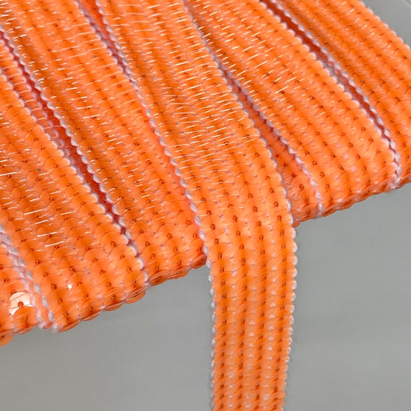 Sequin braid with round FLUO ORANGE sequins in 4 rows of 2 cm wide, sold cut in multiples of 20cm