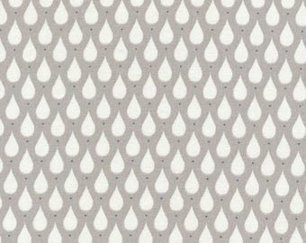 Toile cirée coton enduit motif gouttes blanches sur fond gris taupe vendu a la coupe par multiple de 10cm