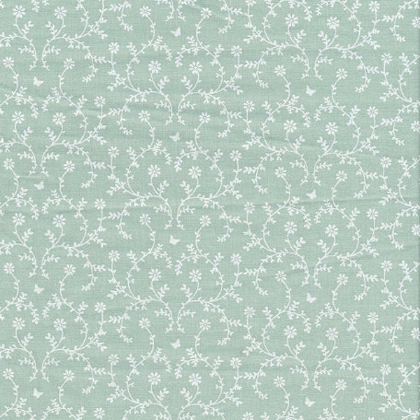 Toile cirée en coton enduit PVC motif fleurie guirlandes de petites fleurs  sur vert tendre, vendu par multiples de 10cm (X142cm de large)