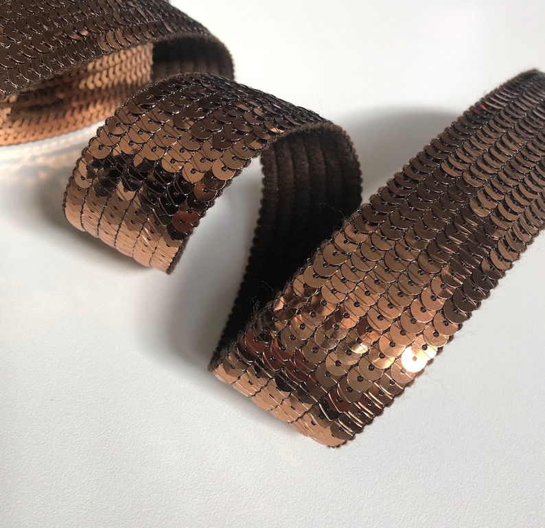 sold to the cut in multiples of 20cm BRONZE SEquins 6 rows of round sequins in 3cm wide