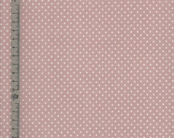 Toile cirée en coton enduit rose motif petits pois blanc, vendu a la coupe par multiples de 10cm (142cm de large)