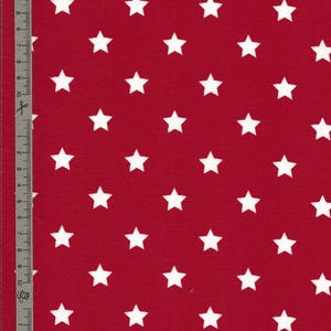 Red coated cotton waxed canvas with white star pattern, sold cut in multiples of 10cm (10X142cm)