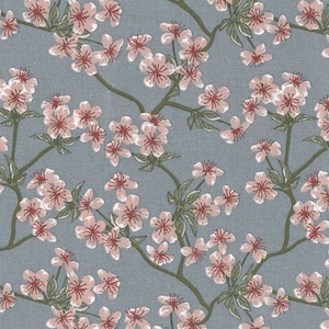 Oilcloth coated cotton Japanese print with pink apple blossom pattern on old blue, sold cut in multiples of 10cm (x142cm)