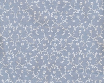 Toile cirée coton bleu lavande imprimé guirlande de fleurs, nappe a la coupe, vendu par multiples de 10cm