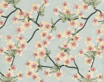 Japanese printed cotton oilcloth with apple blossom pattern on a turquoise coated blue background, sold in multiples of 10cm (142cm wide)