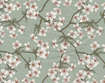 Printed cotton oilcloth with a Japanese design of celadon green apple blossoms, coated with a satin finish, sold by the cut in multiples of 10cm