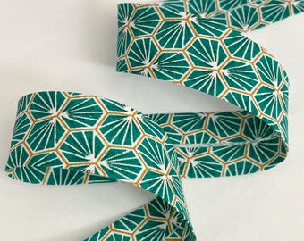 Emerald green cotton bias binding with a geometric honeycomb print, pre-folded with 2 folds, 27mm wide, sold by the meter