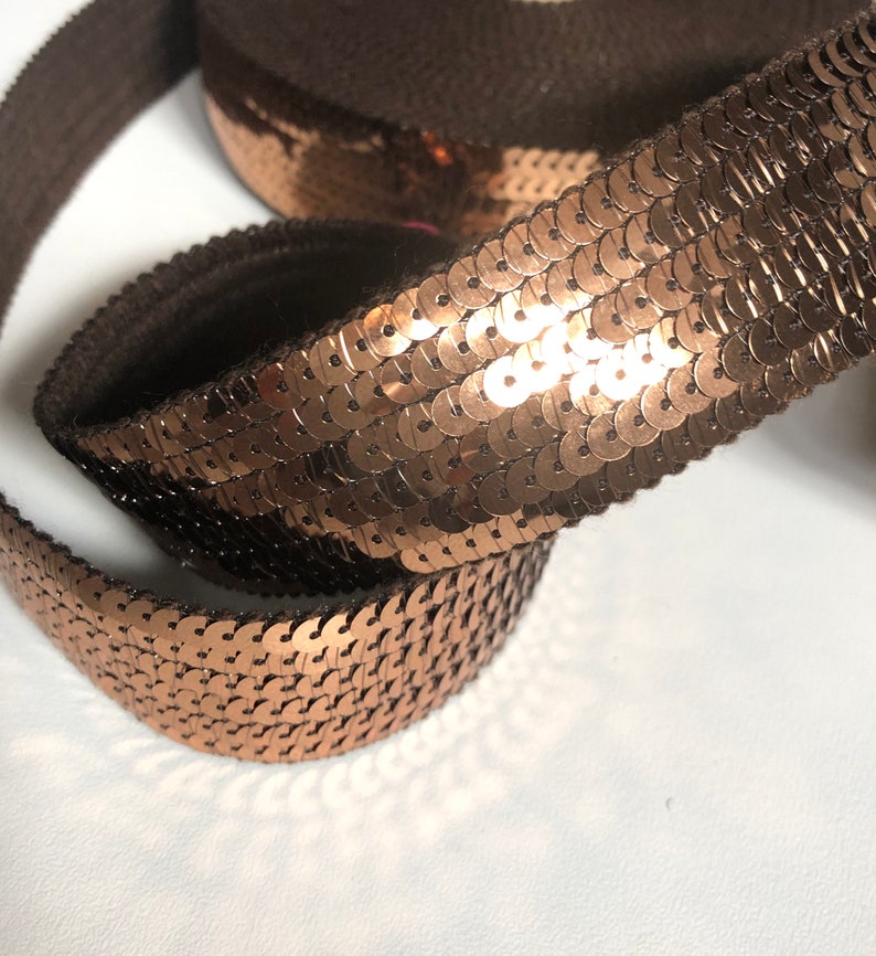 sold to the cut in multiples of 20cm BRONZE SEquins 6 rows of round sequins in 3cm wide