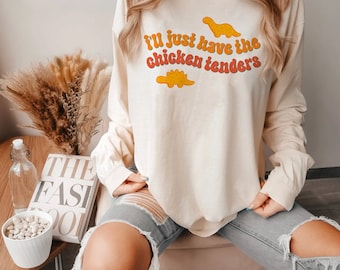 Camiseta de manga larga "Solo quiero los Chicken Tenders" (colores cómodos)