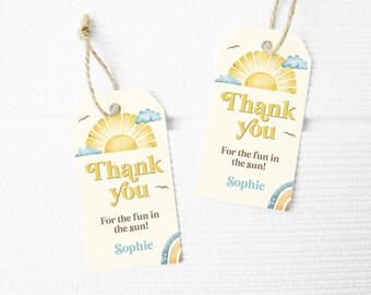 May include: Two yellow and white thank you tags with a sun and clouds design. The text reads "Thank you" and "For the fun in the sun!" with the name "Sophie" at the bottom.