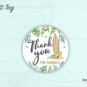 May include: Round white gift tag with a tropical theme. The tag features a surfboard, palm leaves, a pineapple, and a coconut. The text on the tag reads "Thank you for coming!"