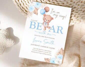 May include: A blue and white baby shower invitation with a cartoon bear holding balloons. The invitation says "Please Bear with me" and includes the date and time of the shower.