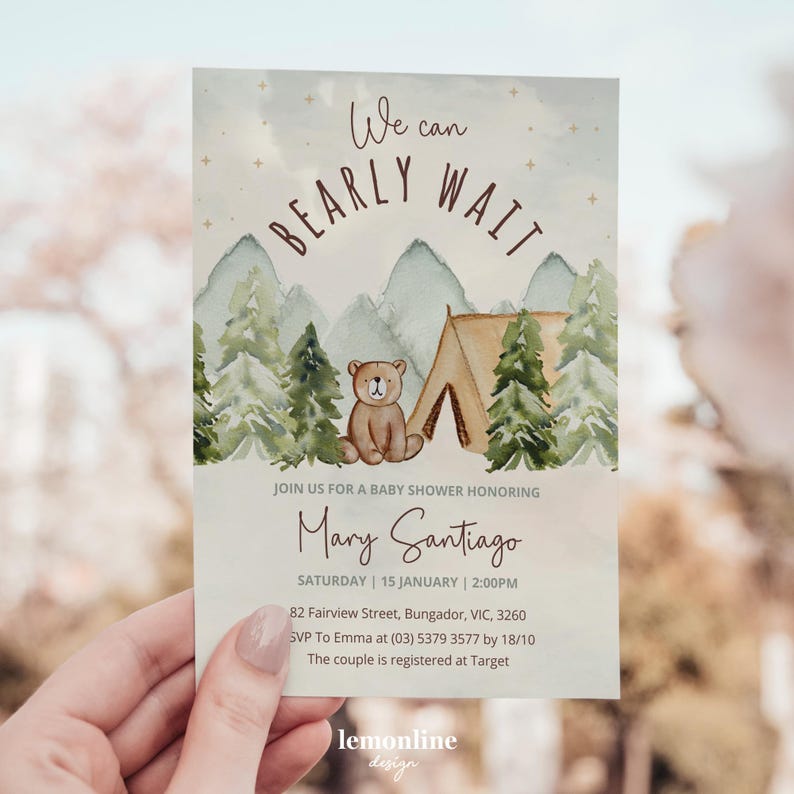 May include: A baby shower invitation with a watercolor illustration of a brown bear sitting in front of a green and brown tent in a forest. The text "We can BEARLY WAIT" is written in brown cursive letters on a blue background with gold stars. The invitation is for Mary Santiago and includes the date, time, and location of the shower.