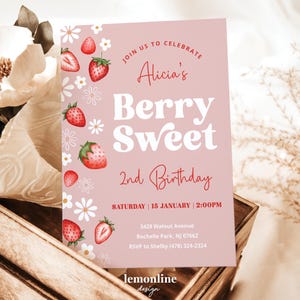 May include: Pink invitation card with a strawberry and flower design. The text reads "Join us to celebrate Alicia's Berry Sweet 2nd Birthday. Saturday, 15 January, 2:00 PM. 3429 Walnut Avenue, Rochelle Park, NJ 07662. RSVP to Shelby (478) 324-2324. lemonline design."