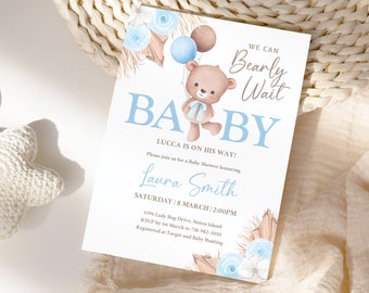 May include: A blue and white baby shower invitation with a cartoon bear holding balloons. The invitation says "We can Bearly Wait" and "Baby" in large blue letters. The text also includes the baby's name, Lucca, the date and time of the shower, and the address.